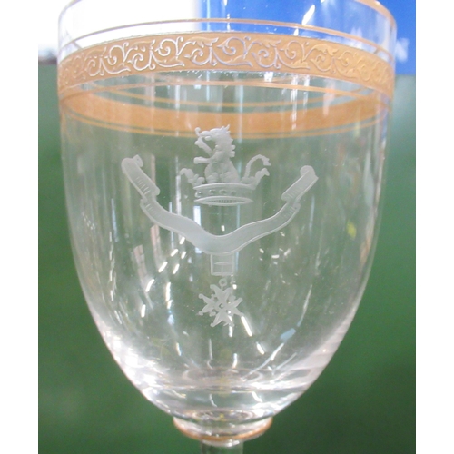 234 - Three drinking glass, each with different gilt decoration and etched with the same crest