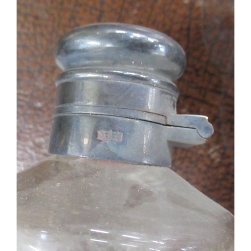 240 - A hunting conical shaped glass flask, with leather case and fittings to attach to a saddle