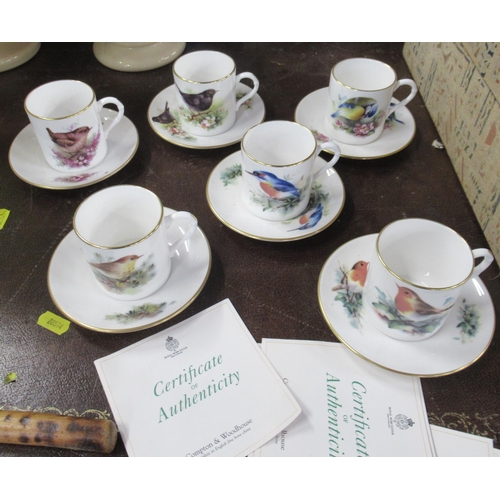 244 - A set of six Royal Worcester Compton and Woodhouse coffee cans and saucers, decorated with birds, wi... 