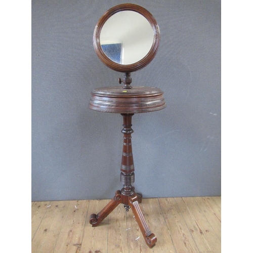 34 - A late Victorian/Edwardian  shaving stand, with adjustable mirror, raised on turned column, terminat... 