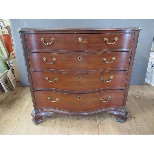 38 - A Georgian mahogany serpentine front chest of drawers, fitted four graduated  drawers , raised on br... 