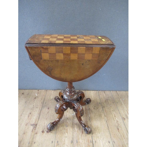 40 - A 19th century walnut games table raised on turned column, terminating in four outswept feet, width ... 