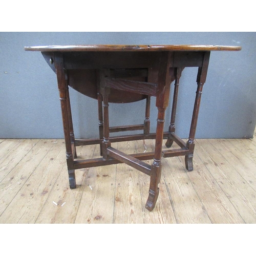 47 - An Antique oak gate leg table, width 38ins, height 28ins