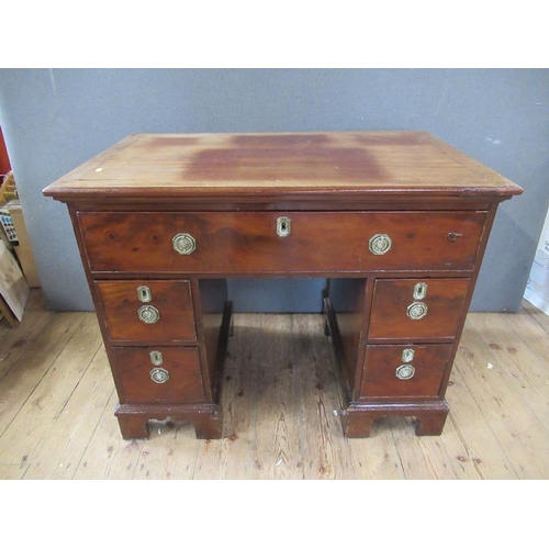 48 - A 19th century mahogany desk, having raising top with ratcheted support, the drawer opening to revea... 