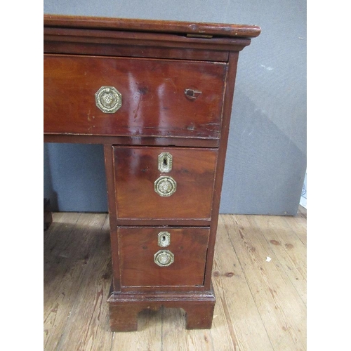 48 - A 19th century mahogany desk, having raising top with ratcheted support, the drawer opening to revea... 