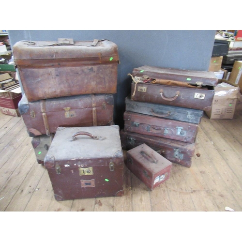 51 - A collection of vintage leather baggage, including, including trunks, suitcases ,holdalls etc, some ... 