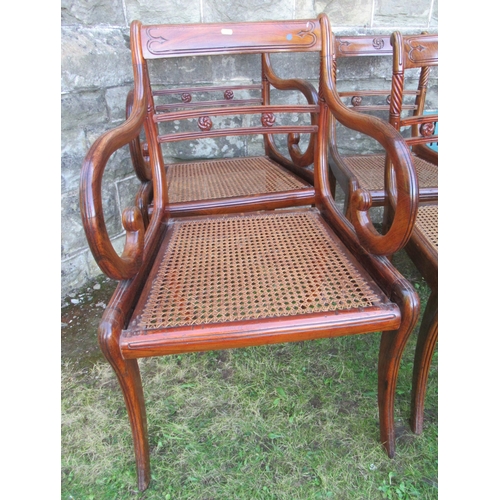 60 - A harlequin set of  13 (11 + 2) Regency mahogany dining chairs, with caned and upholstered seats