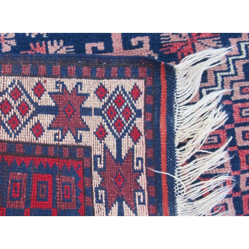 62 - An Eastern design rug, 55ins x 33ins