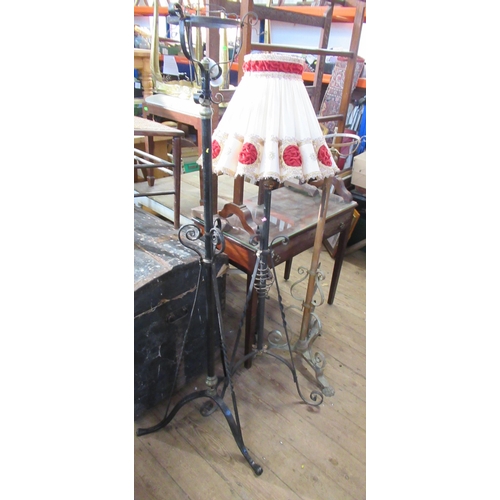 63 - Three wrought iron oil lamp stands, converted to electricity