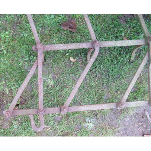 65 - A pair of wrought iron harrows, each 52ins x 36ins