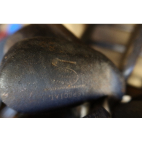 13C - A collection of vintage golf clubs