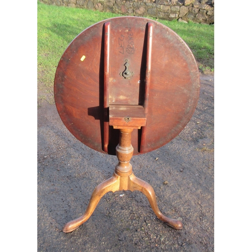 11 - A circular mahogany occasional table, raised on tripod base, width 27ins