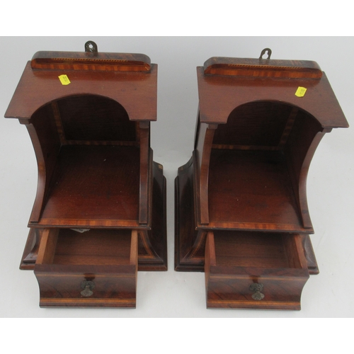 141 - A pair of 19th century mahogany wall shelves, fitted with a drawer, the whole with satinwood banding... 