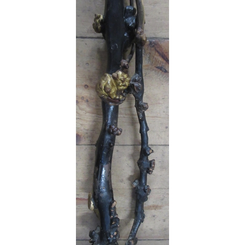 143 - An Eastern walking stick or staff, possibly Japanese, with knurrs and burrs carved and gilded with t... 