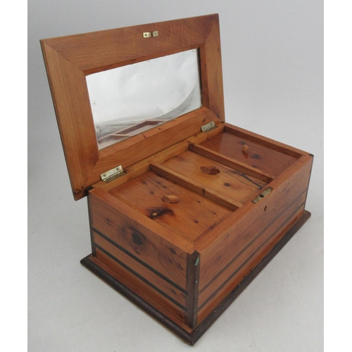 150 - Patrick Maw, a cedar wood box, the interior fitted with three covered compartments and a mirror to t... 