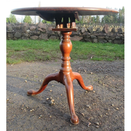 18 - A Georgian mahogany circular occasional table, with bird cage action, turned column to three outswep... 