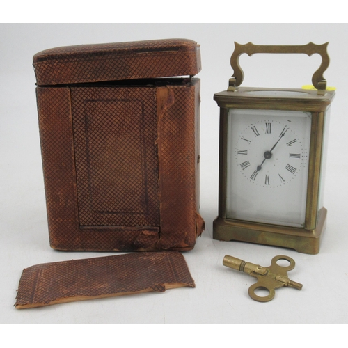 A carriage clock, engraved R&Co Made in Paris, with travel case