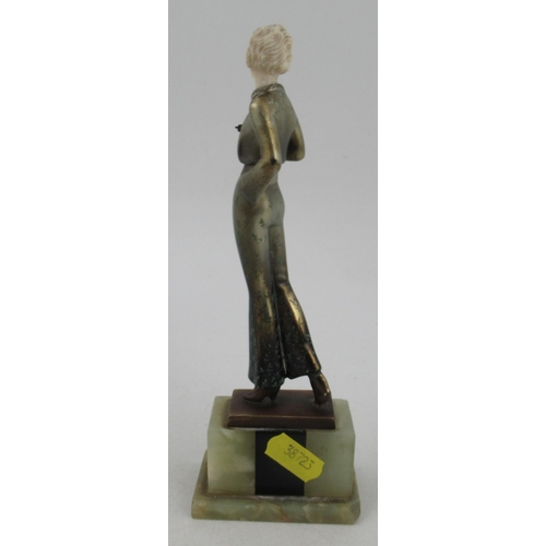 197 - Lorenzl, a patinated bronze and ivorine figure, of a stylish Art Deco woman, signed to bronze base, ... 