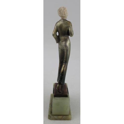 197 - Lorenzl, a patinated bronze and ivorine figure, of a stylish Art Deco woman, signed to bronze base, ... 