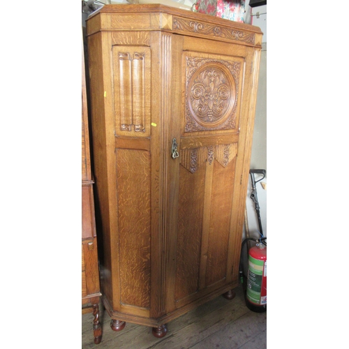 20 - An oak hall cupboard, with carved decoration, height 73ins, width 43ins