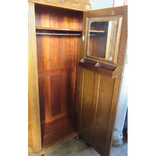 20 - An oak hall cupboard, with carved decoration, height 73ins, width 43ins