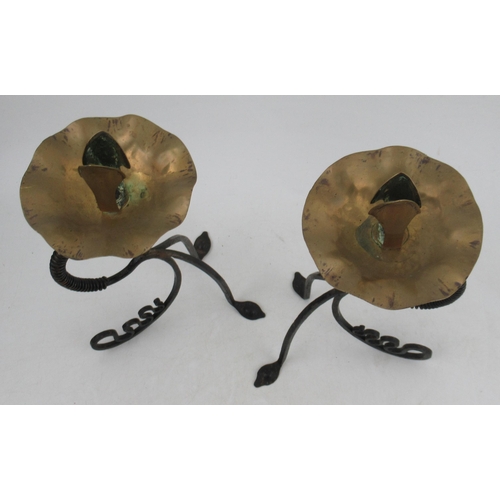 202 - A pair of Arts and Crafts brass and metal candlesticks, formed as flowers, height 11ins