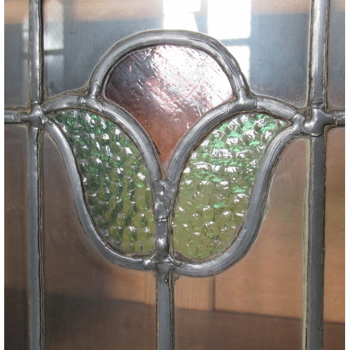 21 - An oak bureau bookcase, with leaded glass decoration, height 79ins, width 34ins