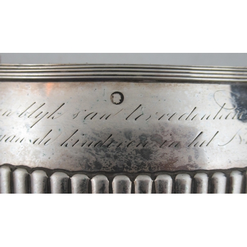 217 - A 19th century Dutch silver oval covered sugar box, with inscription over gadrooned lower body, rais... 