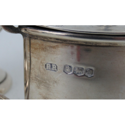 219 - Four pieces of English silver, a jug, mustard pot, salt pot and dressing table pot, weight 9oz