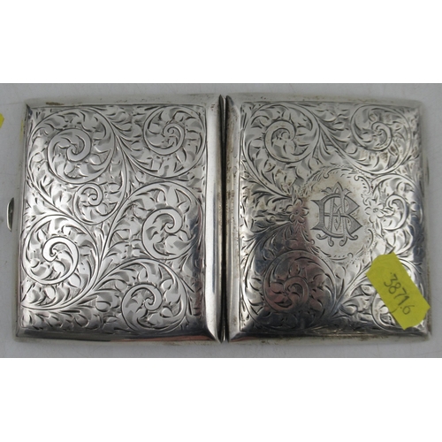 228 - A silver cigarette case, with engraved decoration, together with a Continental silver ladle, marked ... 