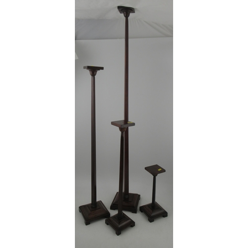 A set of four early 20th century oak and mahogany graduate shop fitting ...