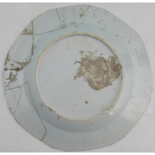 261 - An 18th century Chinese plate, decorated with bamboo and a fence, together with another plate decora... 