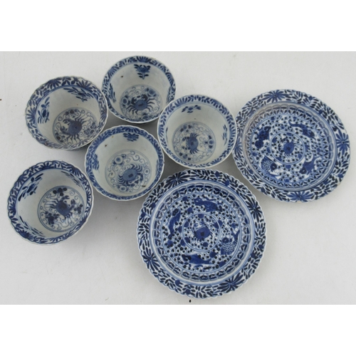 264 - Five Chinese porcelain tea bowls, and two saucers, decorated with crabs and fishes in blue and white... 