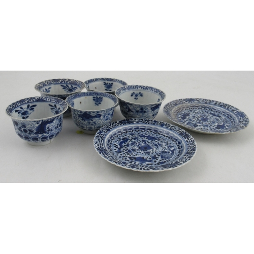 264 - Five Chinese porcelain tea bowls, and two saucers, decorated with crabs and fishes in blue and white... 