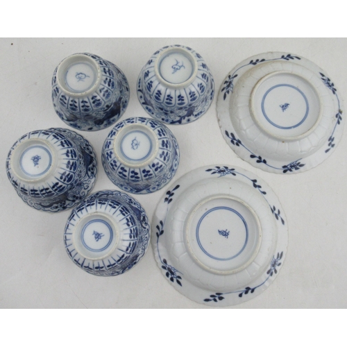 264 - Five Chinese porcelain tea bowls, and two saucers, decorated with crabs and fishes in blue and white... 