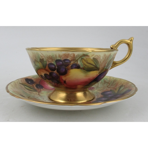 275 - An Ansley cabinet cup and saucer, decorated with fruit to a mossy background, together with a cabine... 