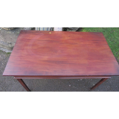 29 - A rectangular mahogany centre table, raised on four square legs, 30ins x 15ins