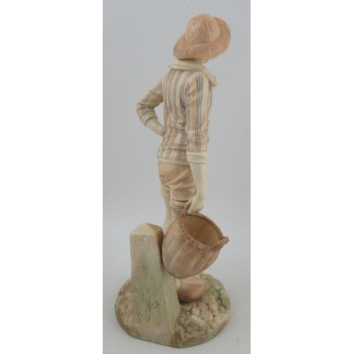 295 - A Royal Worcester Hadley figure, of man in a stripped tunic top, holding a wicker basket, shape No 1... 