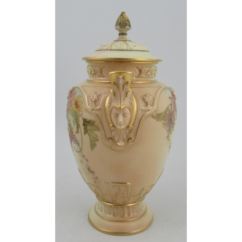 310 - A Royal Worcester blushed ivory vase, with associated cover, decorated with flowers, with masked han... 