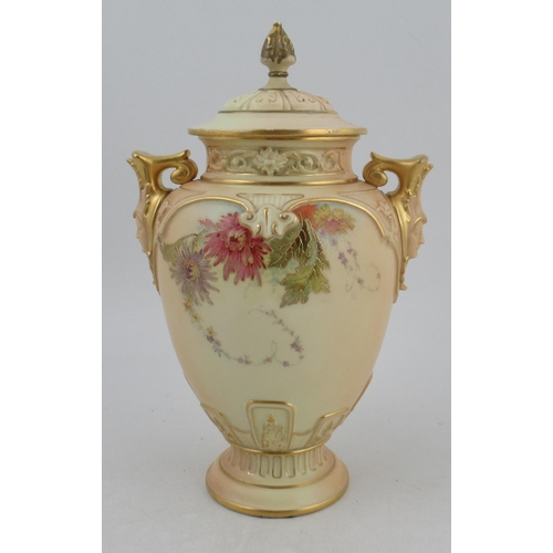 310 - A Royal Worcester blushed ivory vase, with associated cover, decorated with flowers, with masked han... 