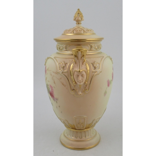 311 - A Royal Worcester blushed ivory vase, with associated cover, decorated with flowers, with masked han... 