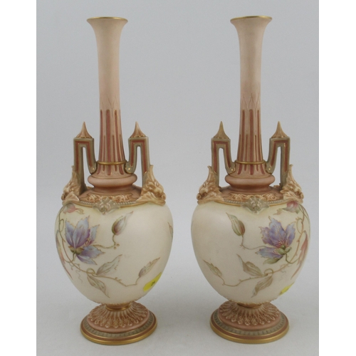 318 - A pair of Royal Worcester vases, decorated with flowers and stylized arch handles, shape No 1406, he... 