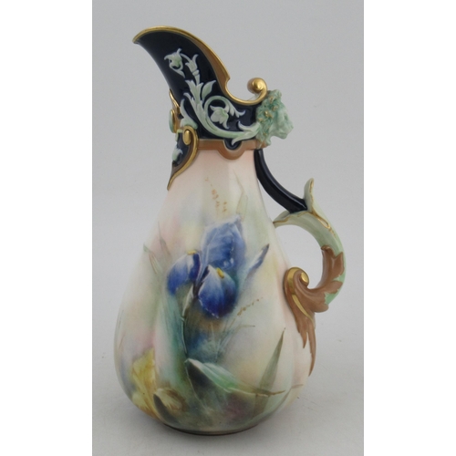 327 - A Hadley Worcester quarter lobbed jug, decorated with irises, with a swirling handle and lion masks,... 