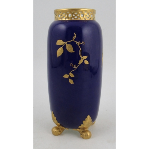 332 - A Royal Worcester spill vase, with knurl feet and pierced neck, decorated with flowers and gilt foli... 