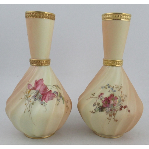 333 - A pair of rhythm moulded blush ivory vases, decorated with flowers, shape No 1452, height 10.5ins