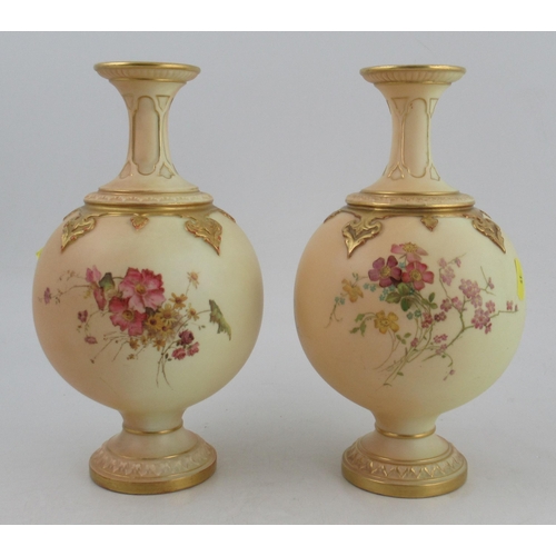 336 - Two Royal Worcester spherical vases, decorated with flowers to a blush ivory ground, shape No 1831, ... 