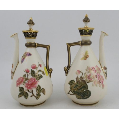 339 - A pair of Royal Worcester Persian style gilt ivory ewers, with stoppers and pierced necks, decorated... 