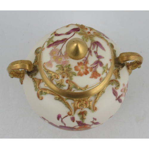 340 - A Royal Worcester spherical glided ivory two handled covered vase, with pierced neck and decorated w... 