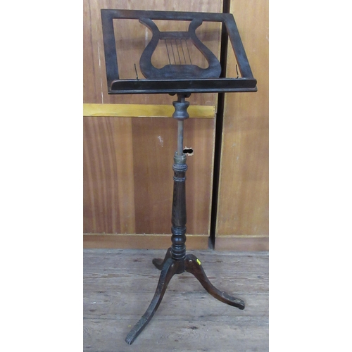 38 - A 19th century faux rosewood adjustable music stand, with brass mounts