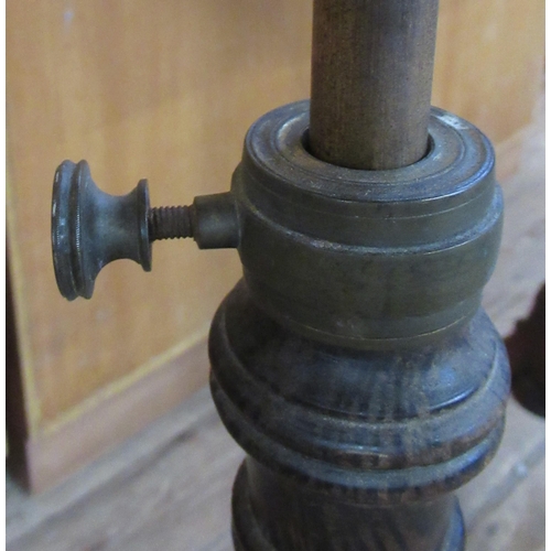 38 - A 19th century faux rosewood adjustable music stand, with brass mounts